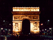 [nighttime photo of Paris's most famous arch]